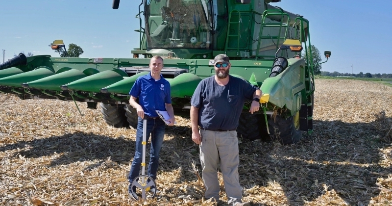 UD’s Drew Harris visits Kent County farmer Jonathan Snow. Extension agents like Harris qualify as supervisors for contestants entering yield information for the National Corn Growers Association’s annual corn yield competition.