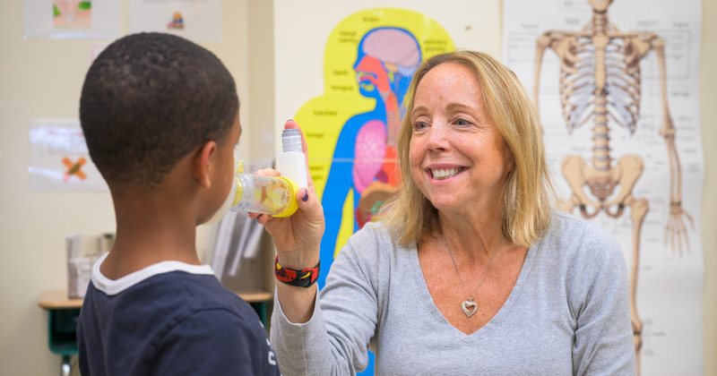 School nurses do far more than apply band-aids. Here, Denise Buffin, the school nurse for Mount Pleasant Elementary, prepares to administer a breathing treatment. She also provides mental health support for students.