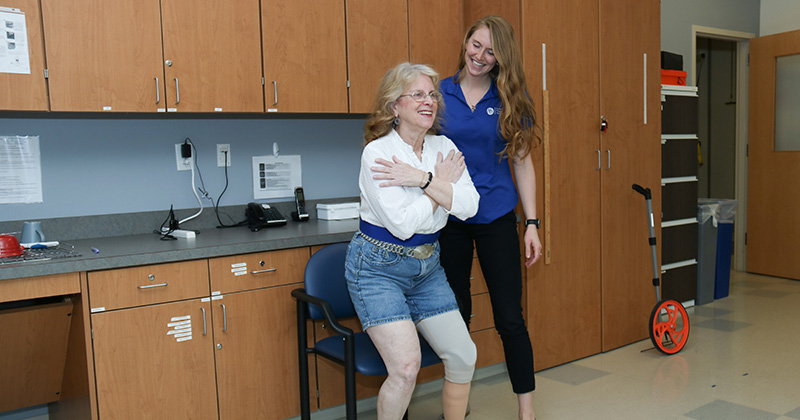 Emma Beisheim-Ryan worked with a patient in UD’s Limb Loss Clinic on a Timed Up and Go (TUG) test to assess functional mobility, which helps guide prosthesis prescription and evaluate baseline function and rehabilitation progress.