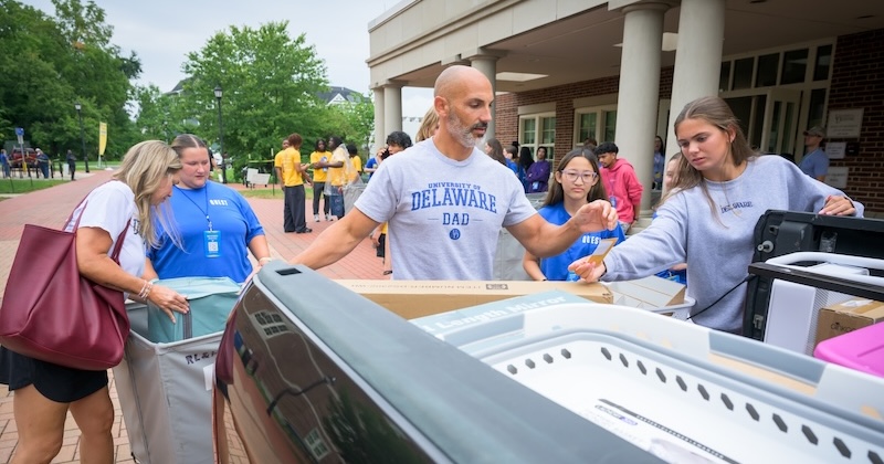 A UD dad unloads a car during move-in as first-year students and their families arrive on campus on Saturday, Aug. 22.