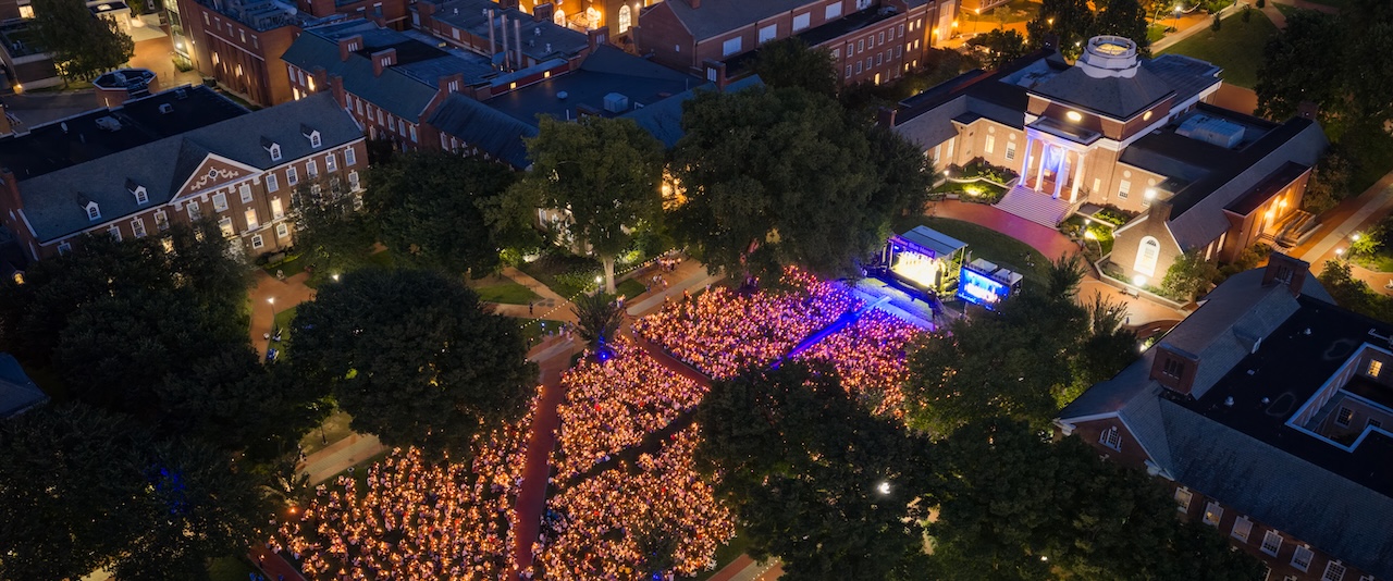 UD’s newest students gather on The Green for the University’s Twilight Induction Ceremony, a ritual that welcomes to campus all new students and marks the official start of their time at UD.