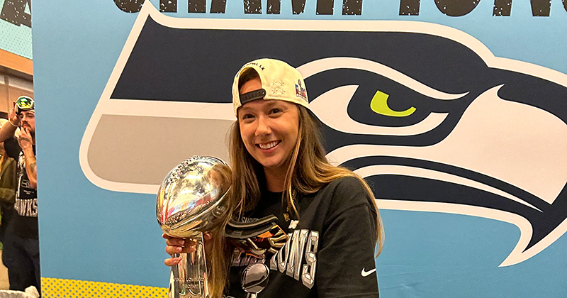 UD alumna Jennifer Witt, a seasonal athletic training intern for the Seattle Seahawks, holds the Lombardi Trophy after the Seahawks won Super Bowl LX.