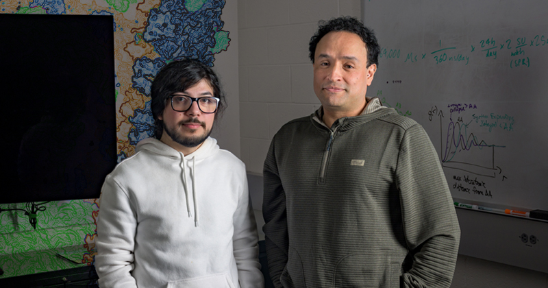 In a major advance, UD professor Juan Perilla (right) and doctoral student Juan S. Rey and their collaborators have revealed a known player’s hidden role in helping HIV mature into an infectious force.