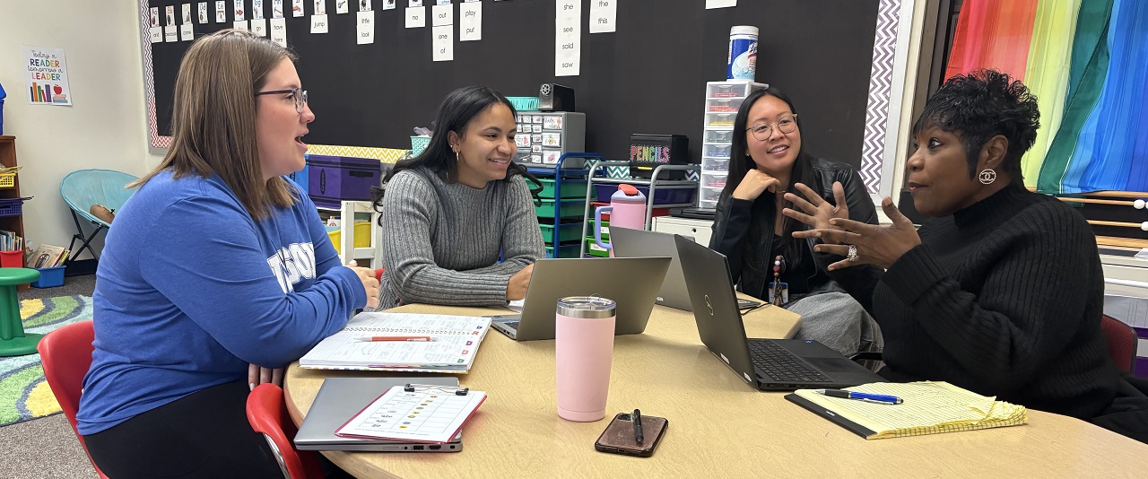 Mabel Boutte (right), principal at Etta J. Wilson Elementary School, talks with teachers Michelle Ramos, Bonnie Hernandez and Jessica Liu in a Wilson classroom.