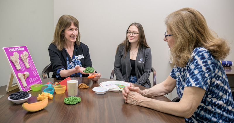 Belinda Pollinger (right) worked with Talia Spitelle (center), a graduate student assistant in the clinic, pursuing her master’s in human nutrition, and Sharon Collison (left), a licensed registered dietitian at UD’s Nutrition Clinic, and learned that food was her medicine. Collison worked with Pollinger to adjust her diet to increase her intake of calories, protein and essential nutrients.