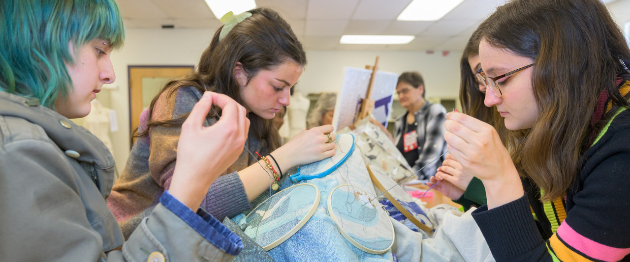 UD fashion design and product innovation students Isa Kennedy, Mackenzie Smaldon, Sydney Jasser and Monica Grace (left to right) work on Delaware’s panel for an exhibit called America’s Tapestry which is part of the country’s 250th anniversary celebration.