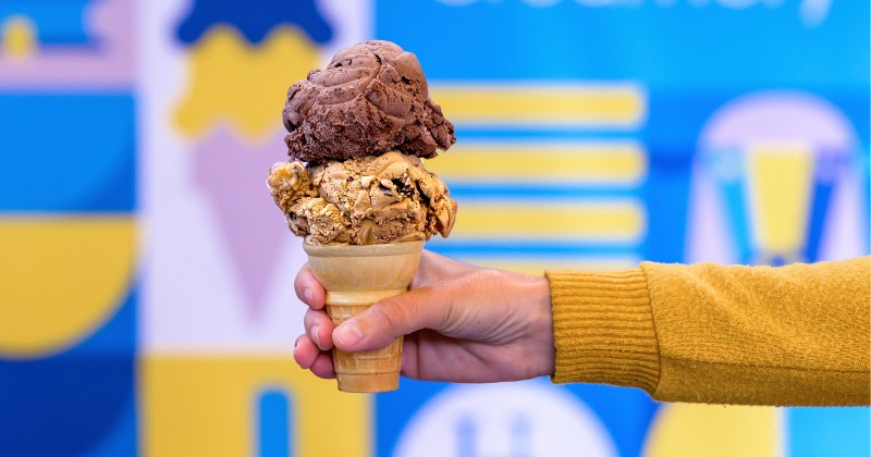 A finished ice cream cone with Delaware River Mud Pie on the bottom and All Nighter on top.