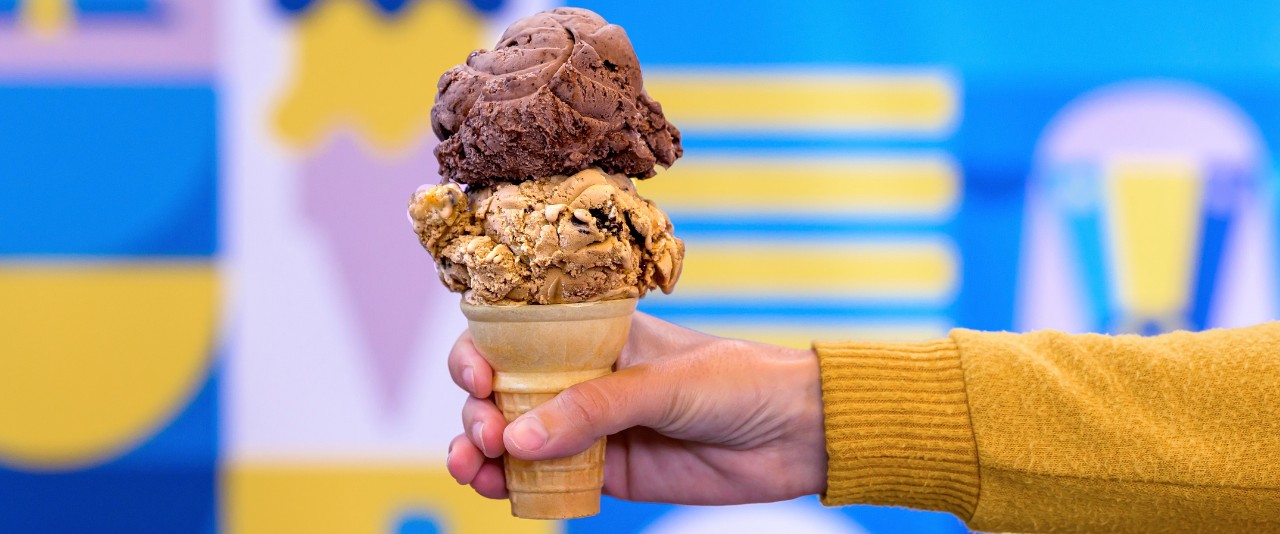 A finished ice cream cone with Delaware River Mud Pie on the bottom and All Nighter on top.