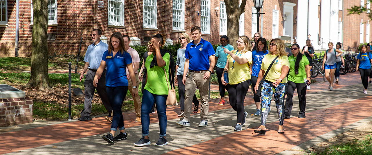 Employees walking together on campus