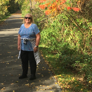 Diane Wright standing on hiking trail