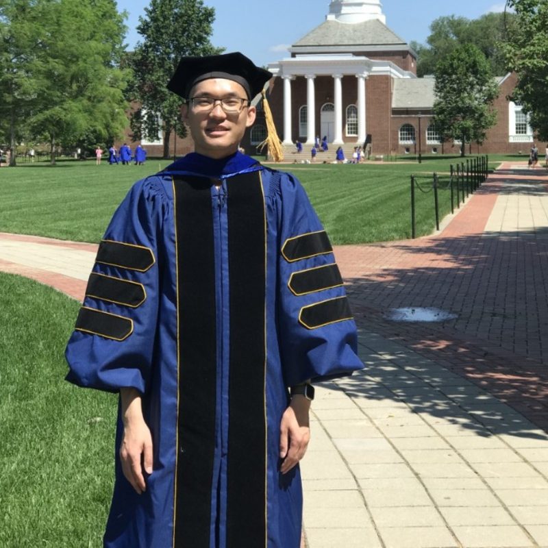 Photo of Yunjiao Cai near Memorial Hall on the University of Delaware campus