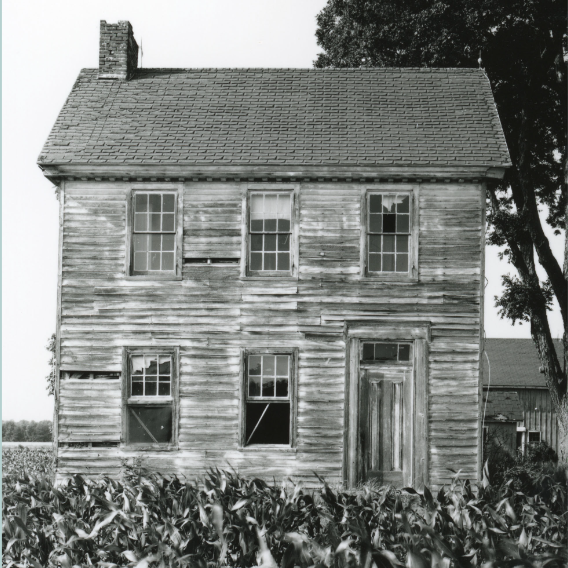 Black and white exterior photo of a threatened Kent County property