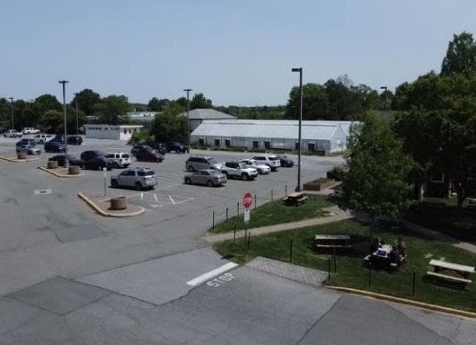 The existing parking lot that will be removed.