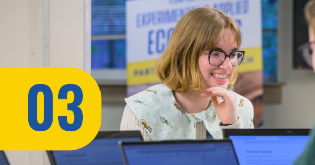 A girl working at a computer.