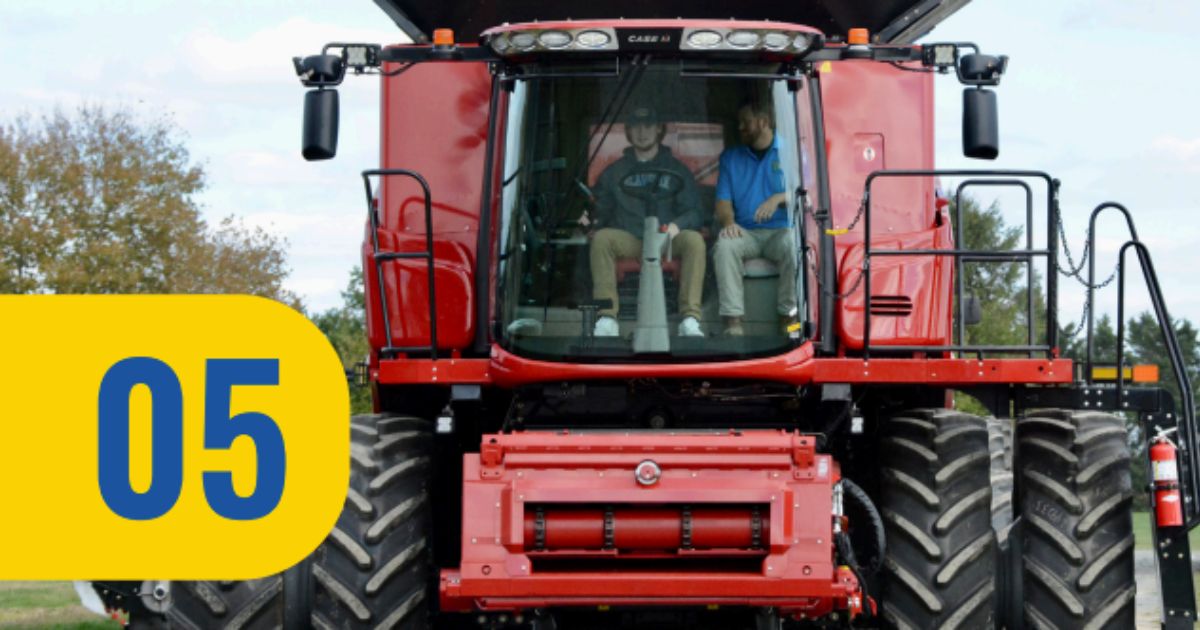 A student learning to drive a massive tractor.