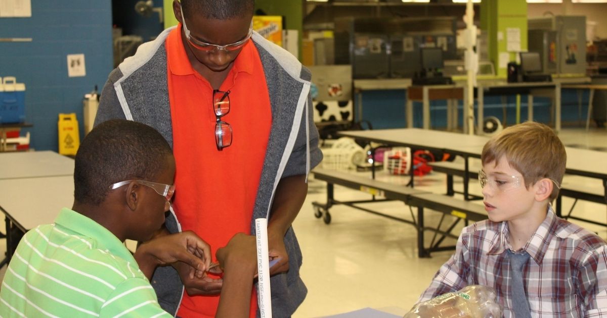 4-H Afterschool students doing a science experiment.