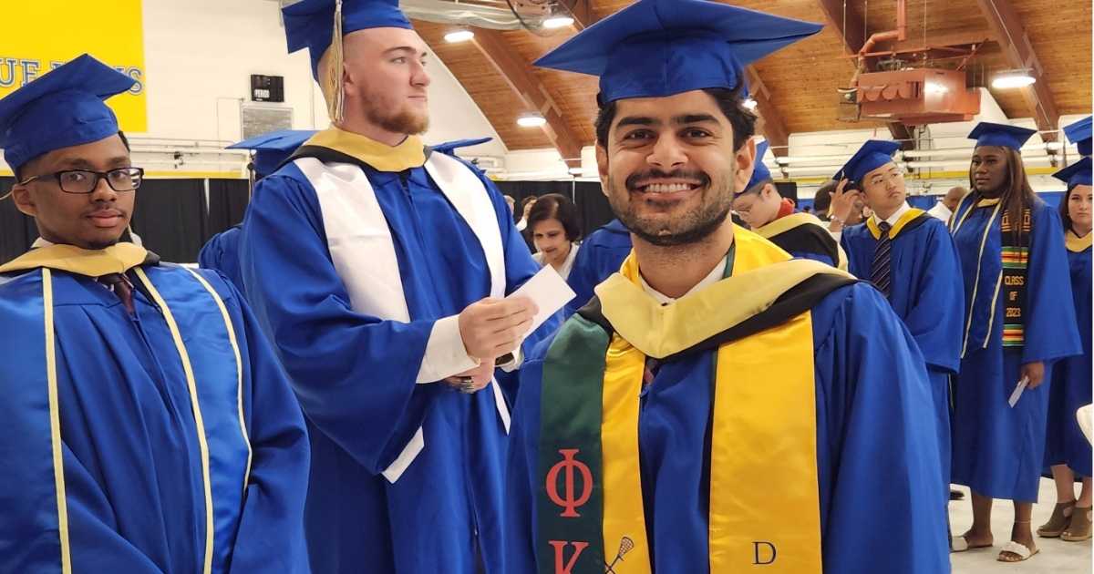 CANR students smiling in line at graduation in 2023.
