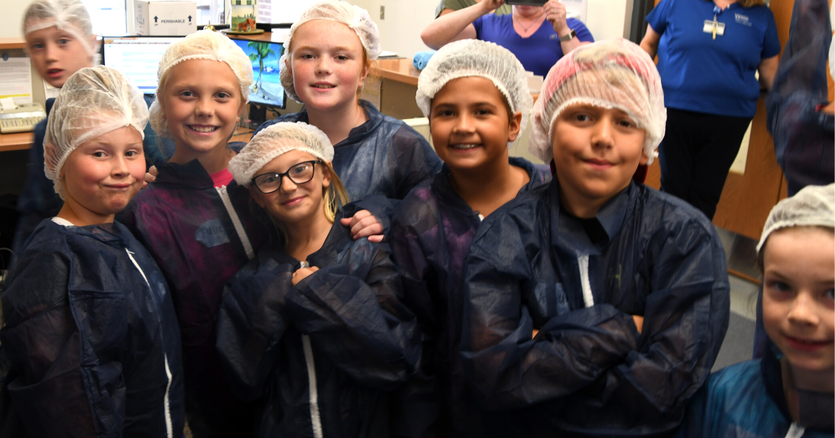Campers prepare for a laboratory tour during Sussex County's 4-H Extension Day Camp in 2019 Campers dressed in scrubs prepare for a laboratory tour during Sussex County's 4-H Extension Day Camp in 2019