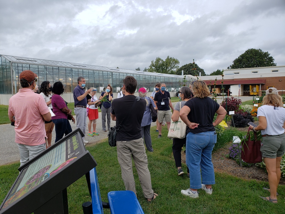 Bob Lyons, UD professor emeritus, walks Master Gardener trainees through the trial gardens at the UD Botanic Gardens.