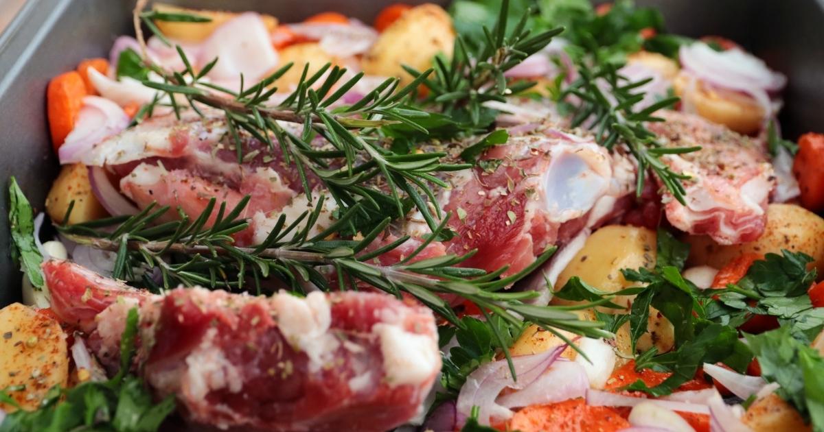 Goat meat with rosemary, garlic and vegetables ready for roasting!