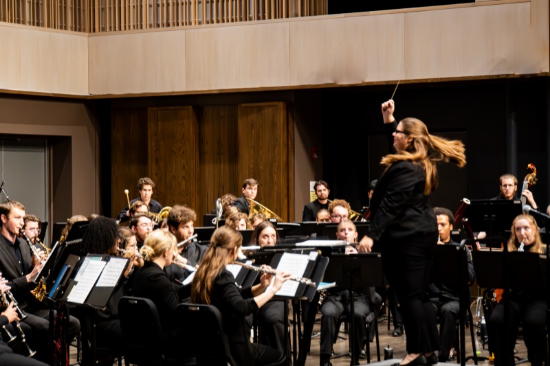 Koviack action shot conducting student band