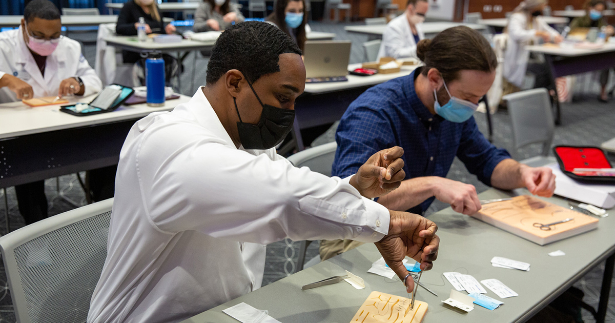 DNP students practice suturing DNP students practice suturing