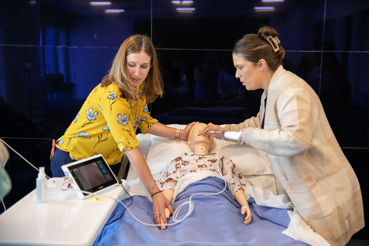 Speech Language Pathology students performing an endoscope simulation