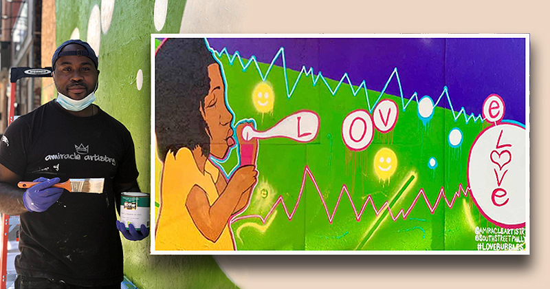 Amir Campbell and his painting, "Love Bubbles"
