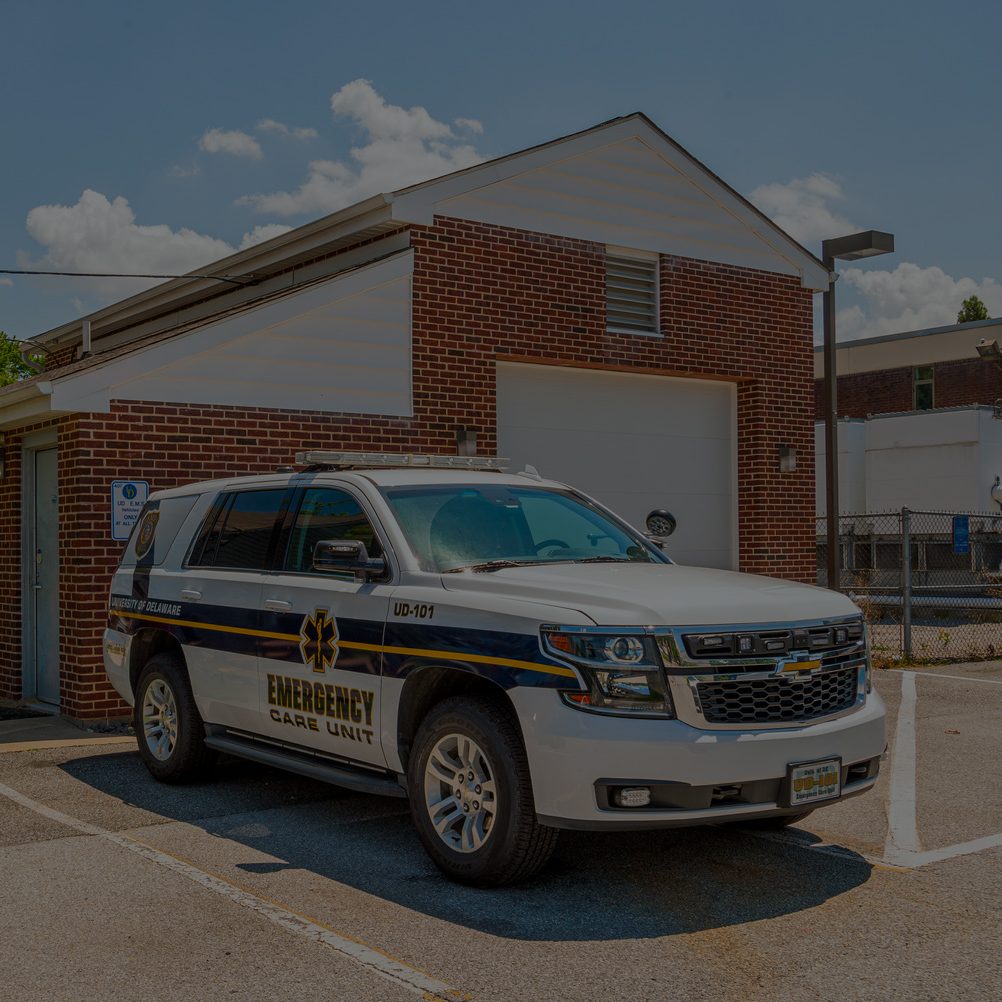 rescue vehicle parked outside a garage