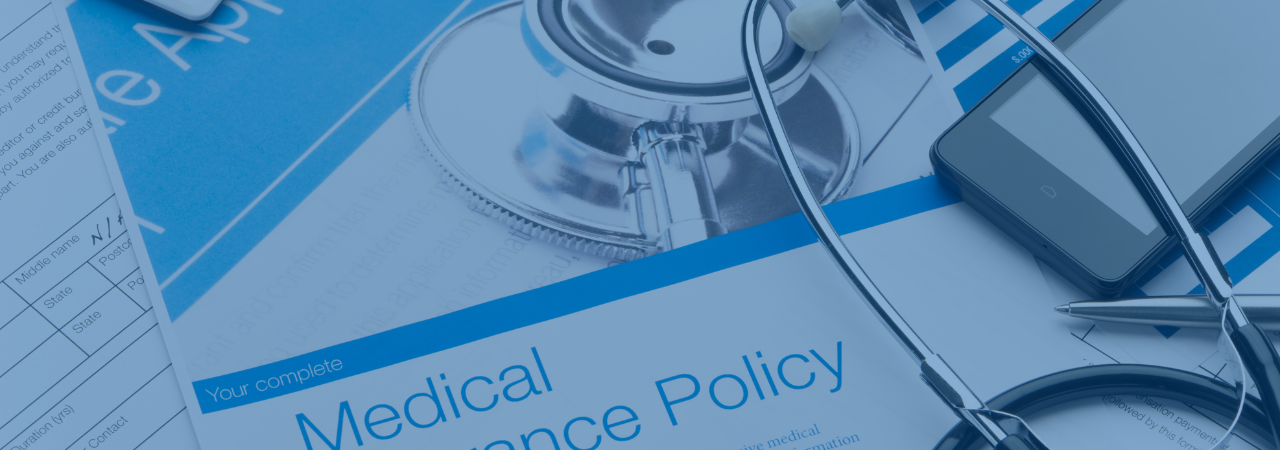 Medical insurance policy booklet with stethoscope
