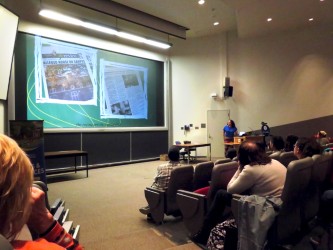 Minority Mentor Event Lecture hall filled with people and a speaker at a podium at the front of the room