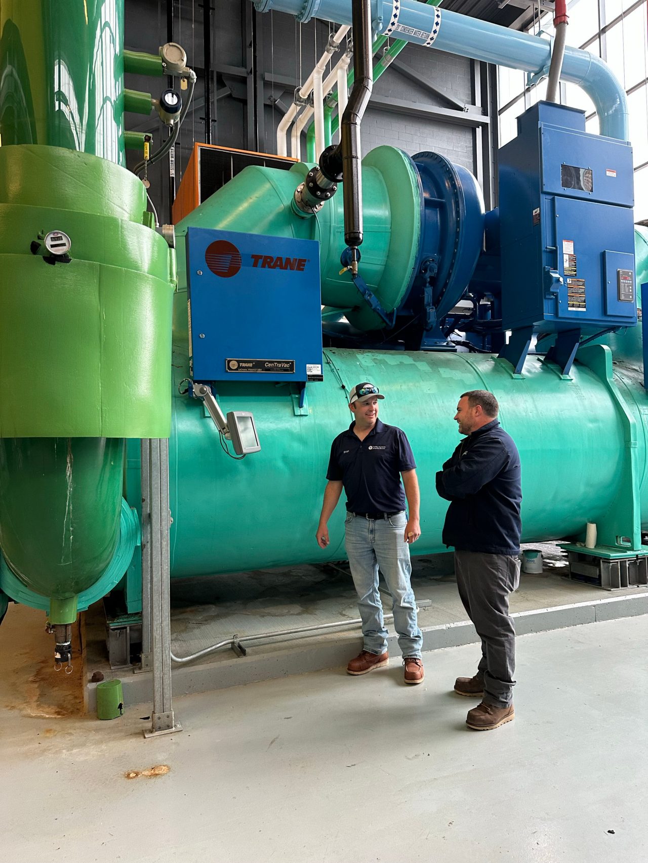 Brian and Joe HVAC Brian and Joe standing in front of UD's HVAC systems
