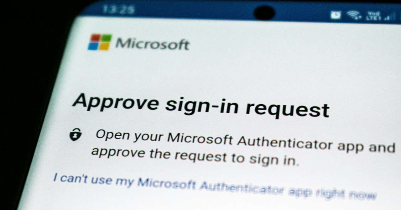 A close-up of a smartphone screen displaying a Microsoft multi-factor authentication prompt that reads, "Approve sign-in request."