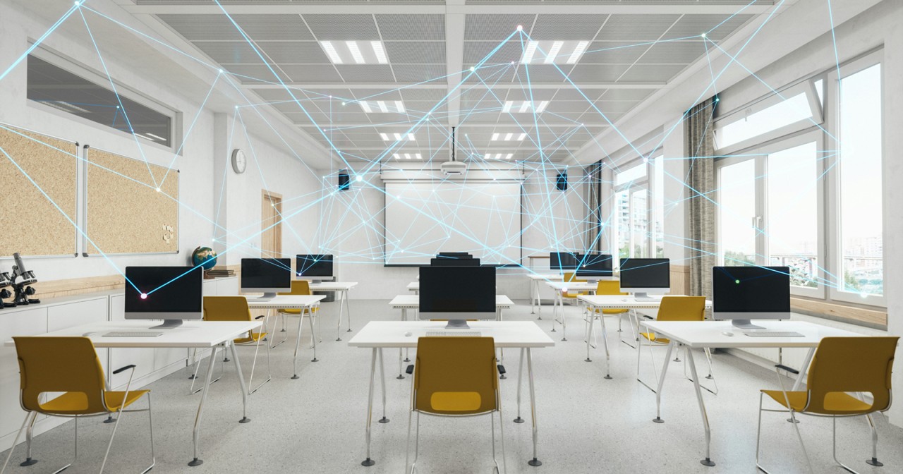 Bright, empty modern classroom with rows of white desks, computer monitors, and yellow chairs facing a projector screen, overlaid with glowing blue lines connecting points across the room to suggest a digital network.