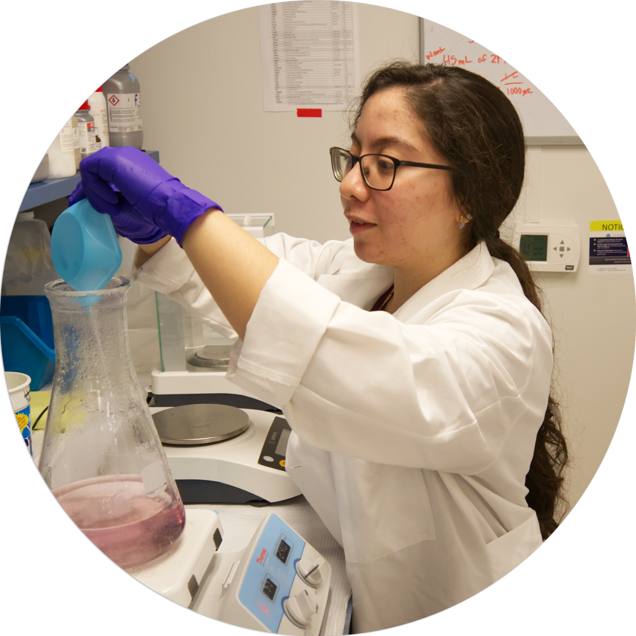 2020-02-26__CANR_ANFS_Graduate-Program_Amy-Biddle_Alexa-Johnson_Gisselle-Garcia Gisselle Garcia in the lab holding a test tube.