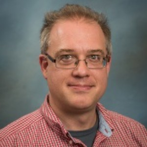 Headshot photo of Christopher Raymond