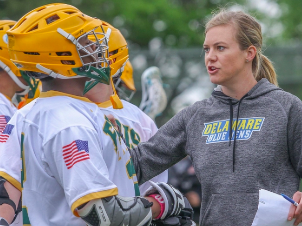 Kalyn McDonough, Ph.D., Urban Affairs and Public Policy, talking to lacrosse players