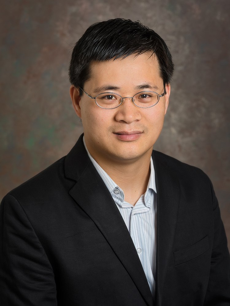 Publicity photo of Guoquan Huang, assistant professor of mechanical engineering.