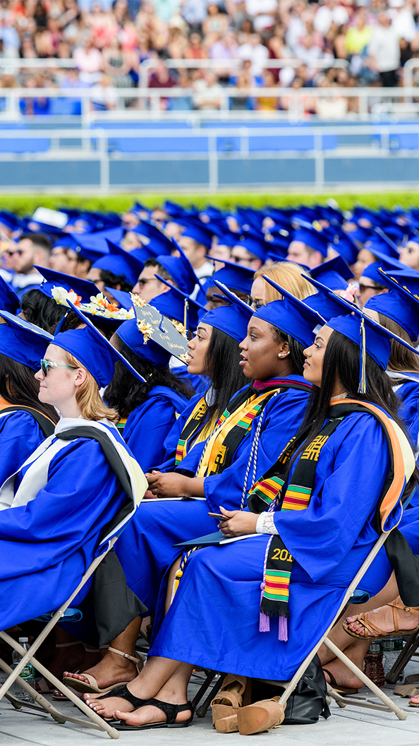 Students in cap and gown at the UD Commencement ceremoney