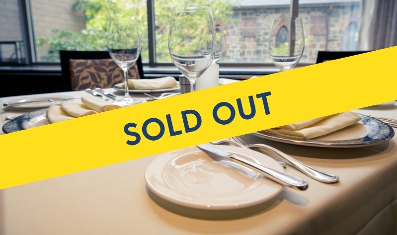 Fine dining table placements in Vita Nova with Sold Out banner