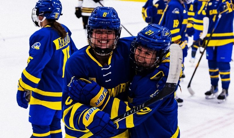 Two hockey players celebrating