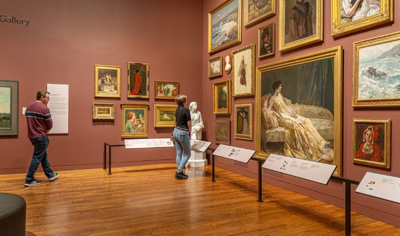 Visitors viewing artwork in the Delaware Art Museum