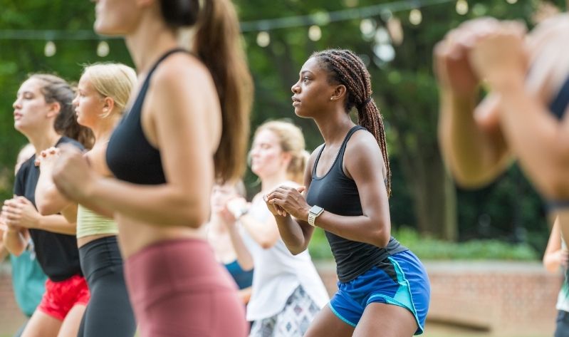 Students exercise on The Green