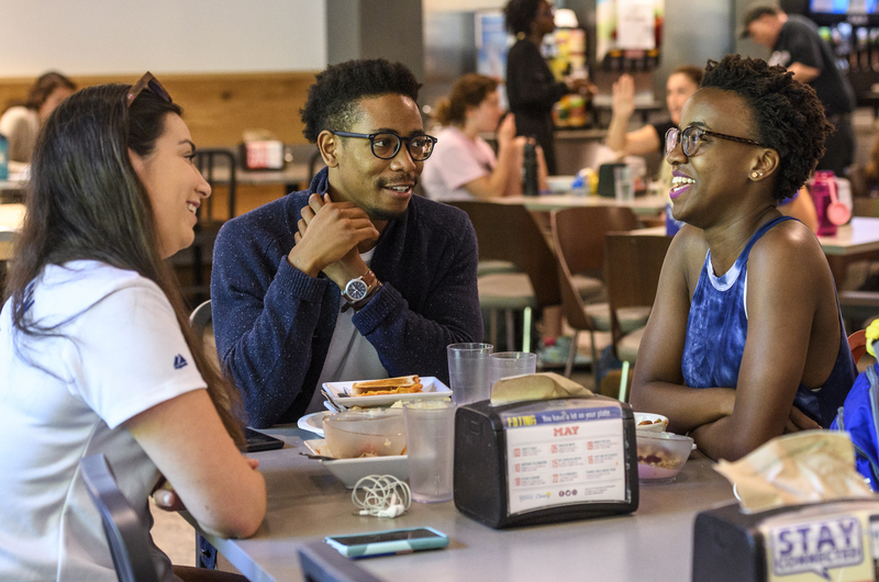 Students talking in Caesar Rodney Dining Hall