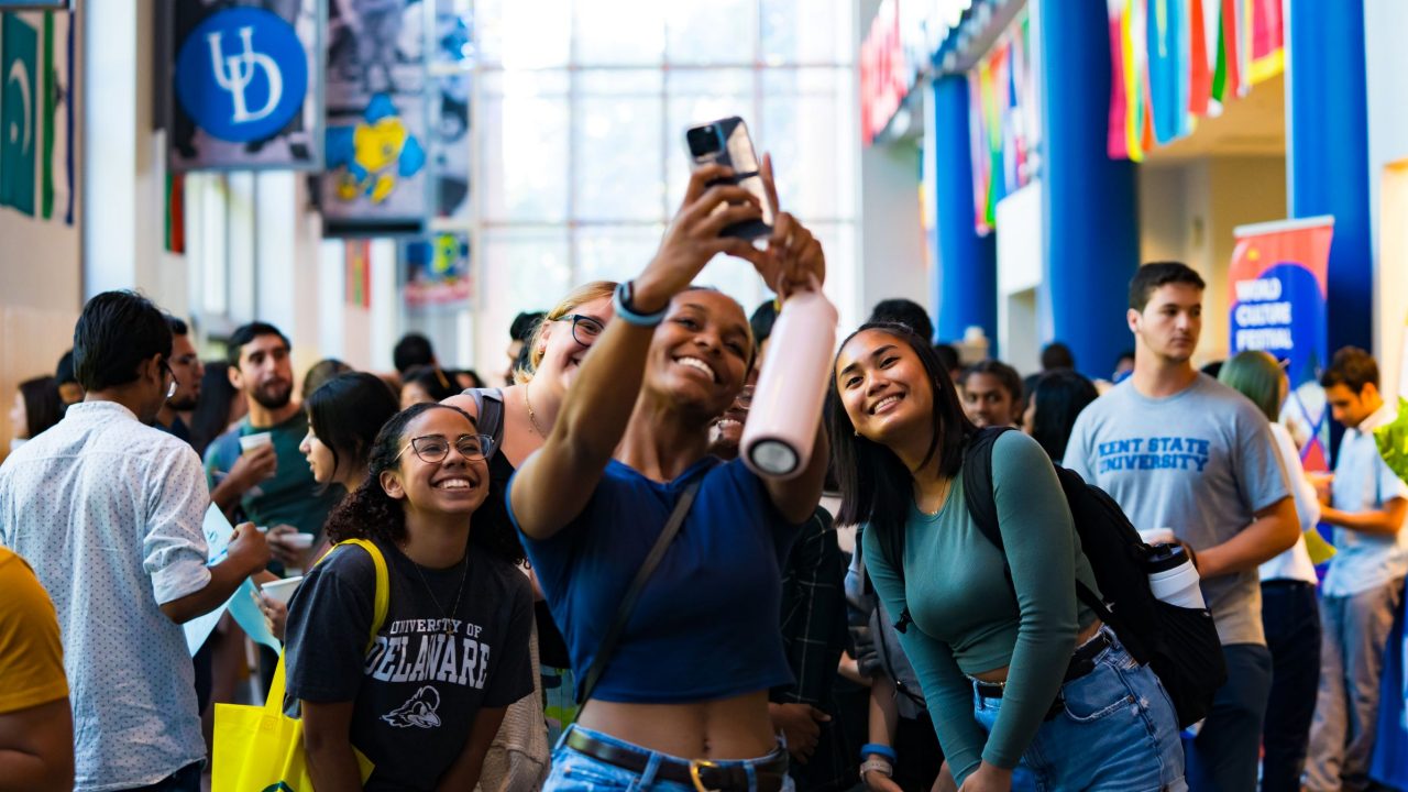 Students take a selfie at the CGPS International Coffee Hour