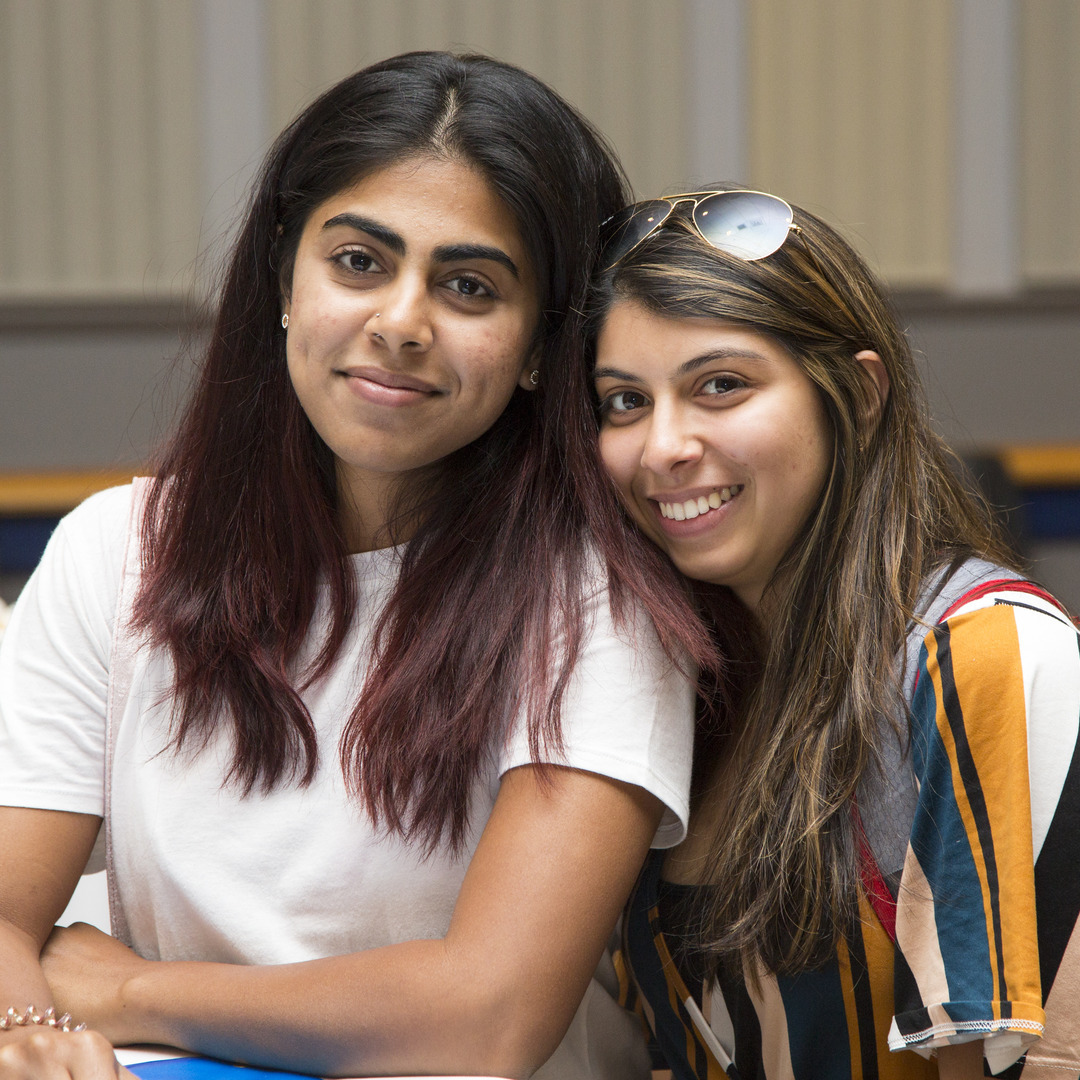 Two female students smiling