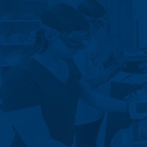 Two students work with lab equipment in ISE