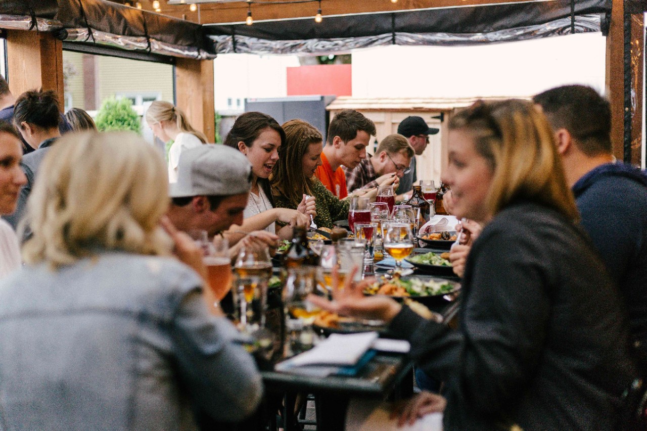 friends eating dinner together at a table