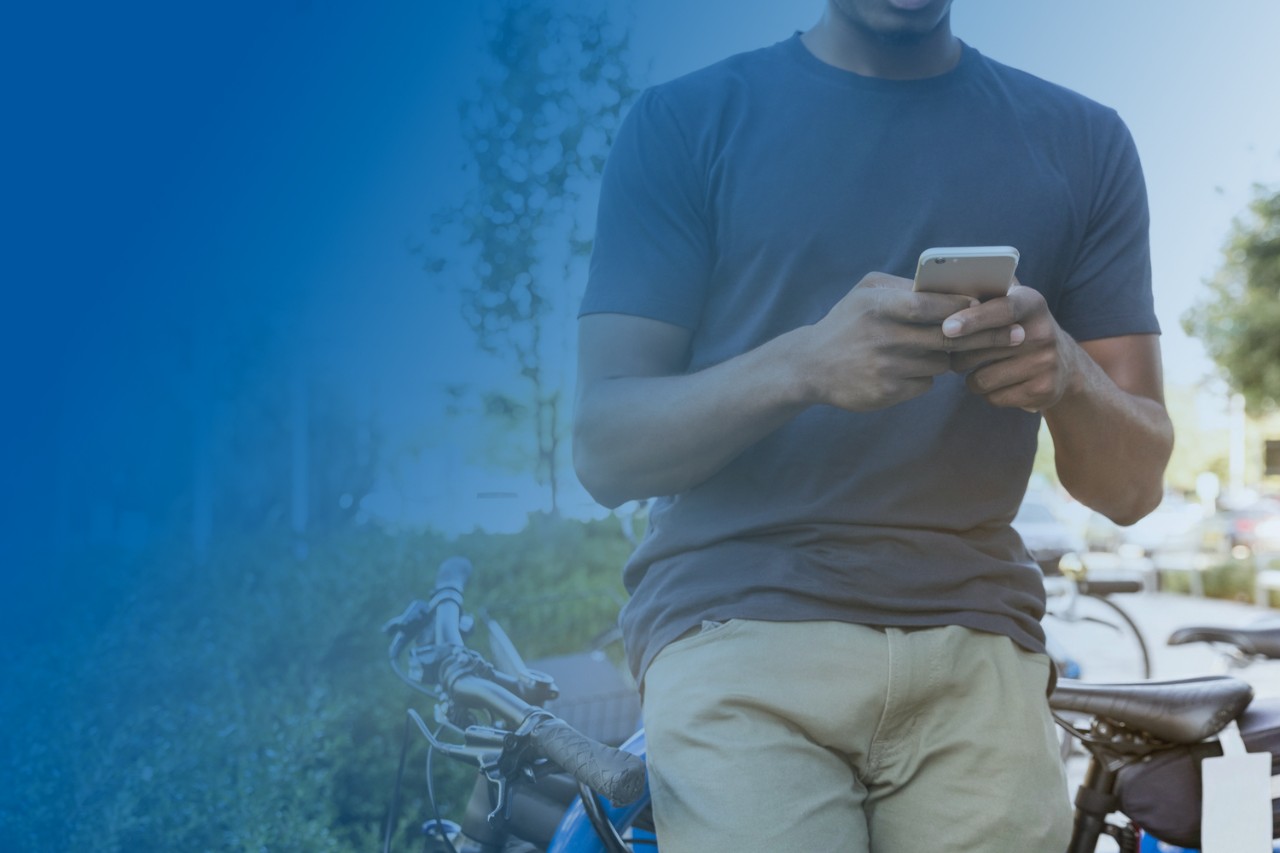 Male student holding smartphone