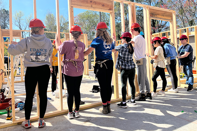 Students volunteer with Habitat for Humanity to build housing in New Bern, NC